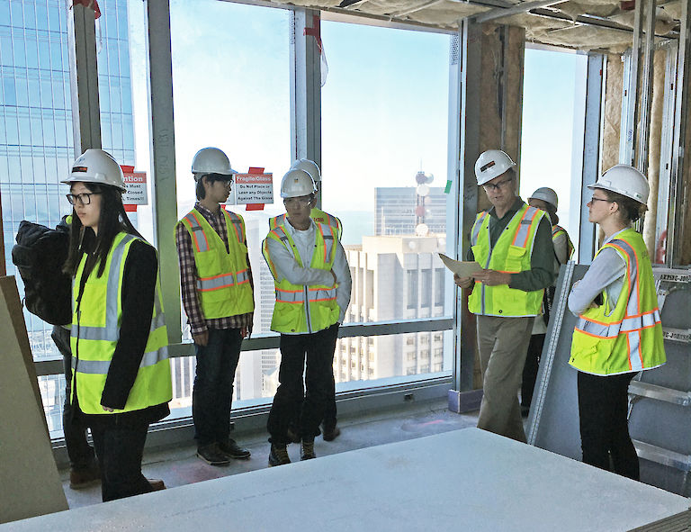 HWI architects and designers tour the 181 Fremont building in San Francisco during construction.